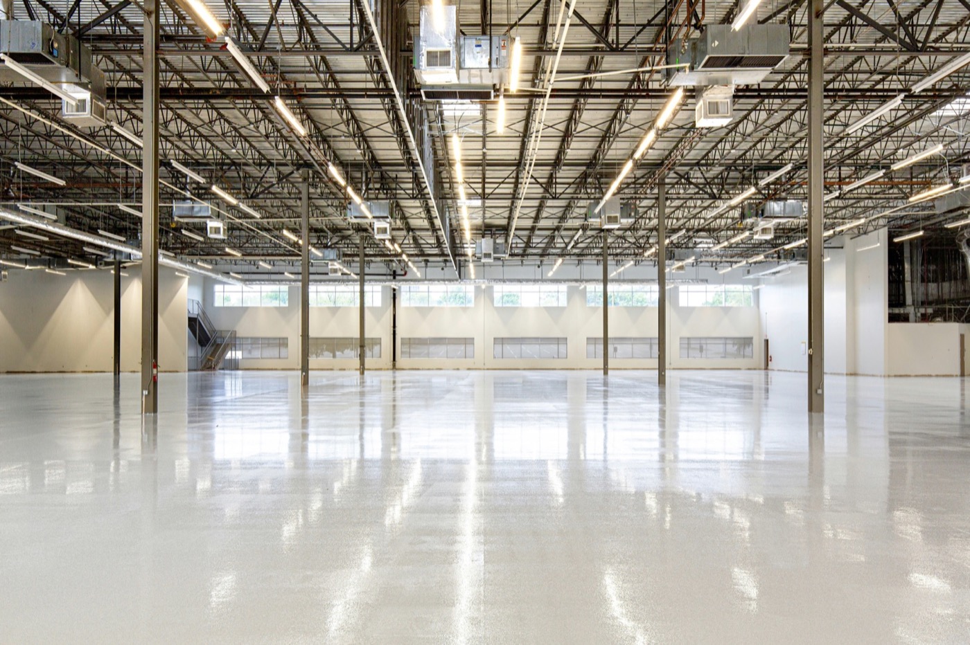 Empty retail store interior with light streaming through the front window