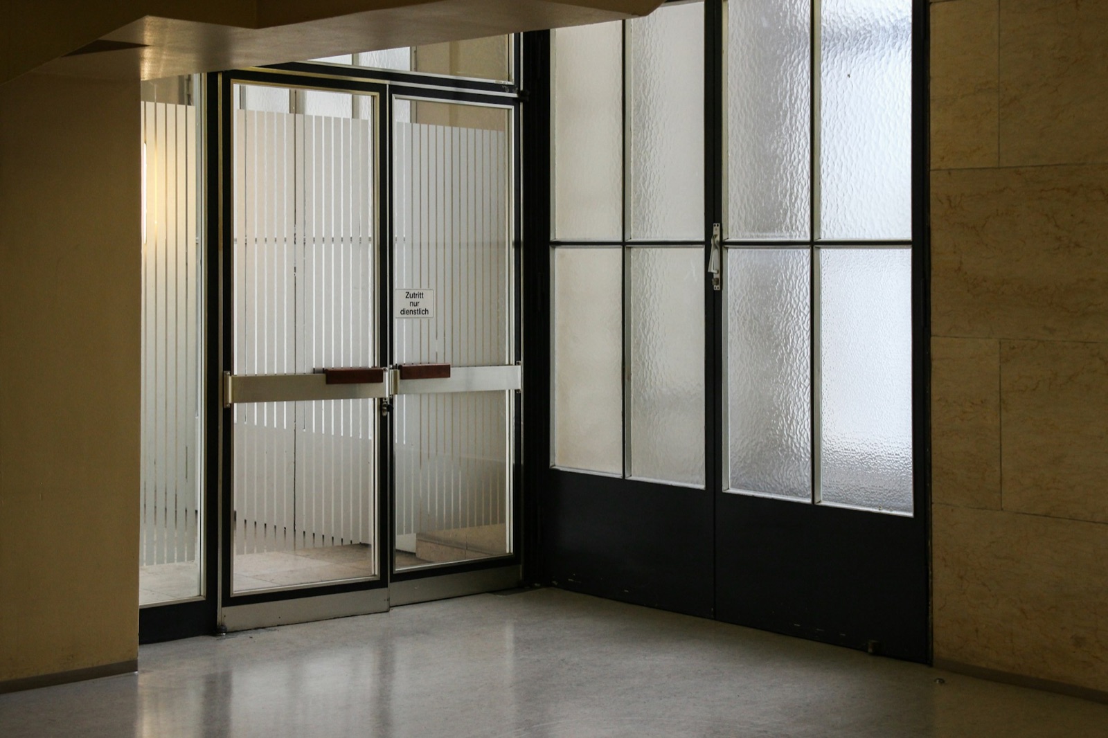 Empty retail store interior with light streaming through the front window