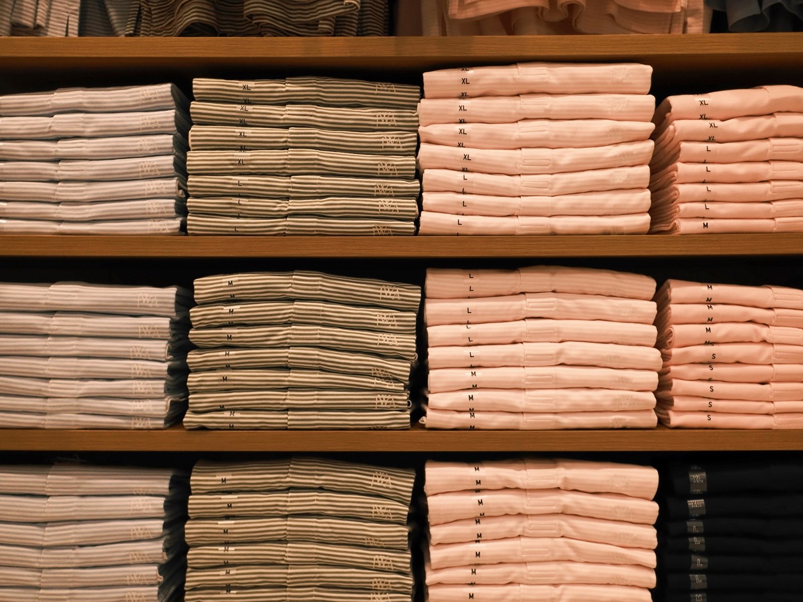 Neatly folded dress shirts on a retail display