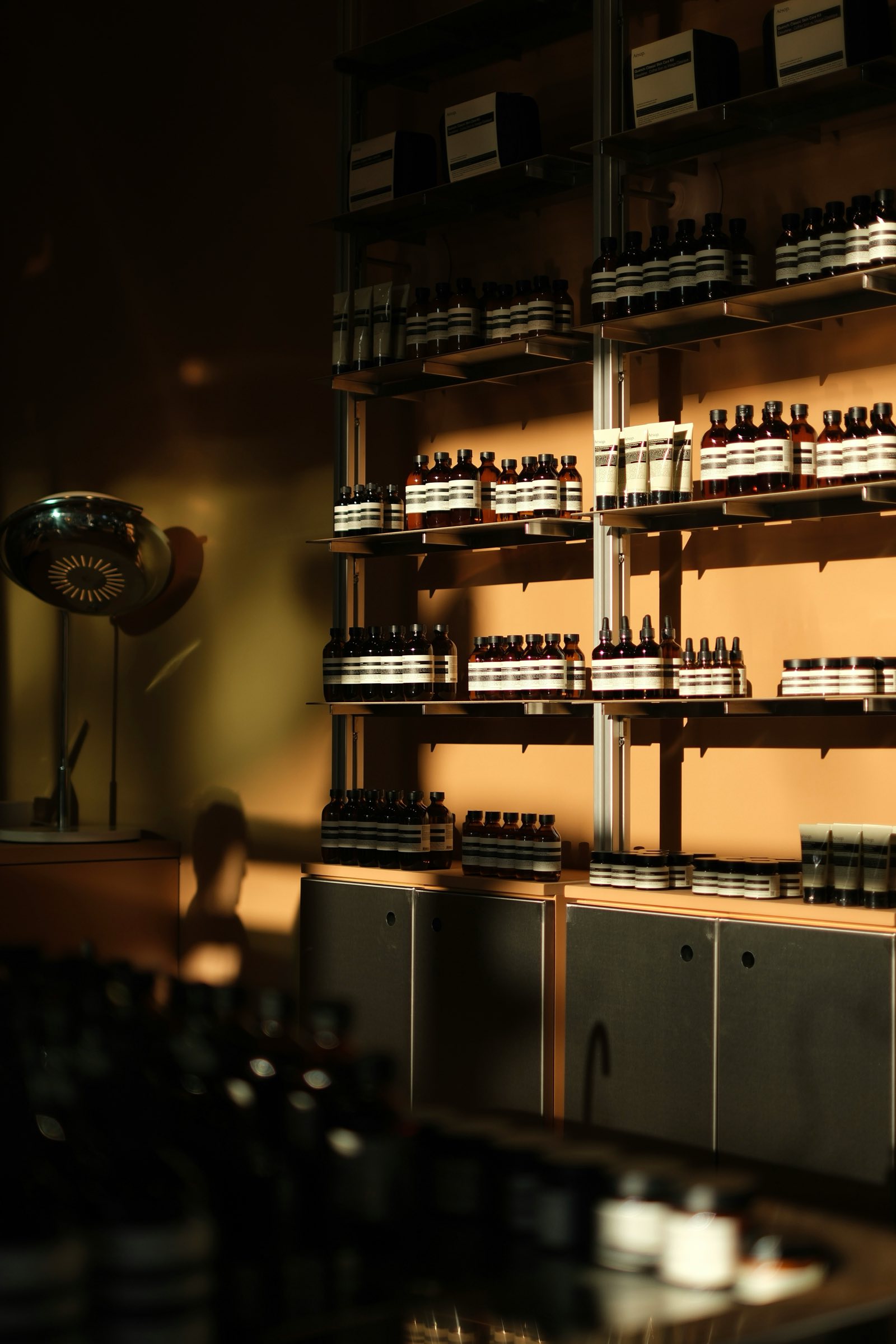 Beauty supply store shelves stocked with skincare bottles