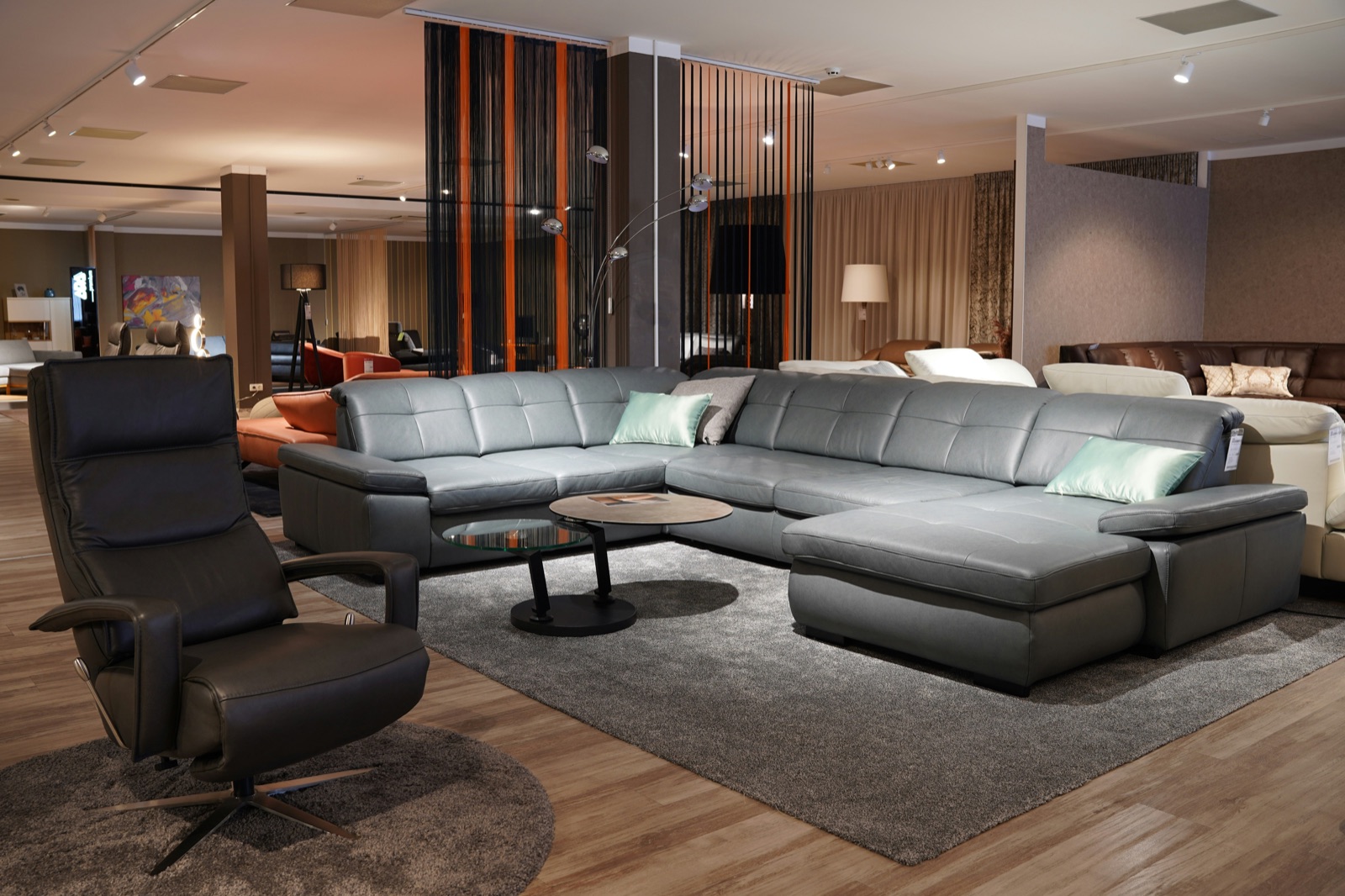 Furniture showroom interior with sofas and a wooden floor