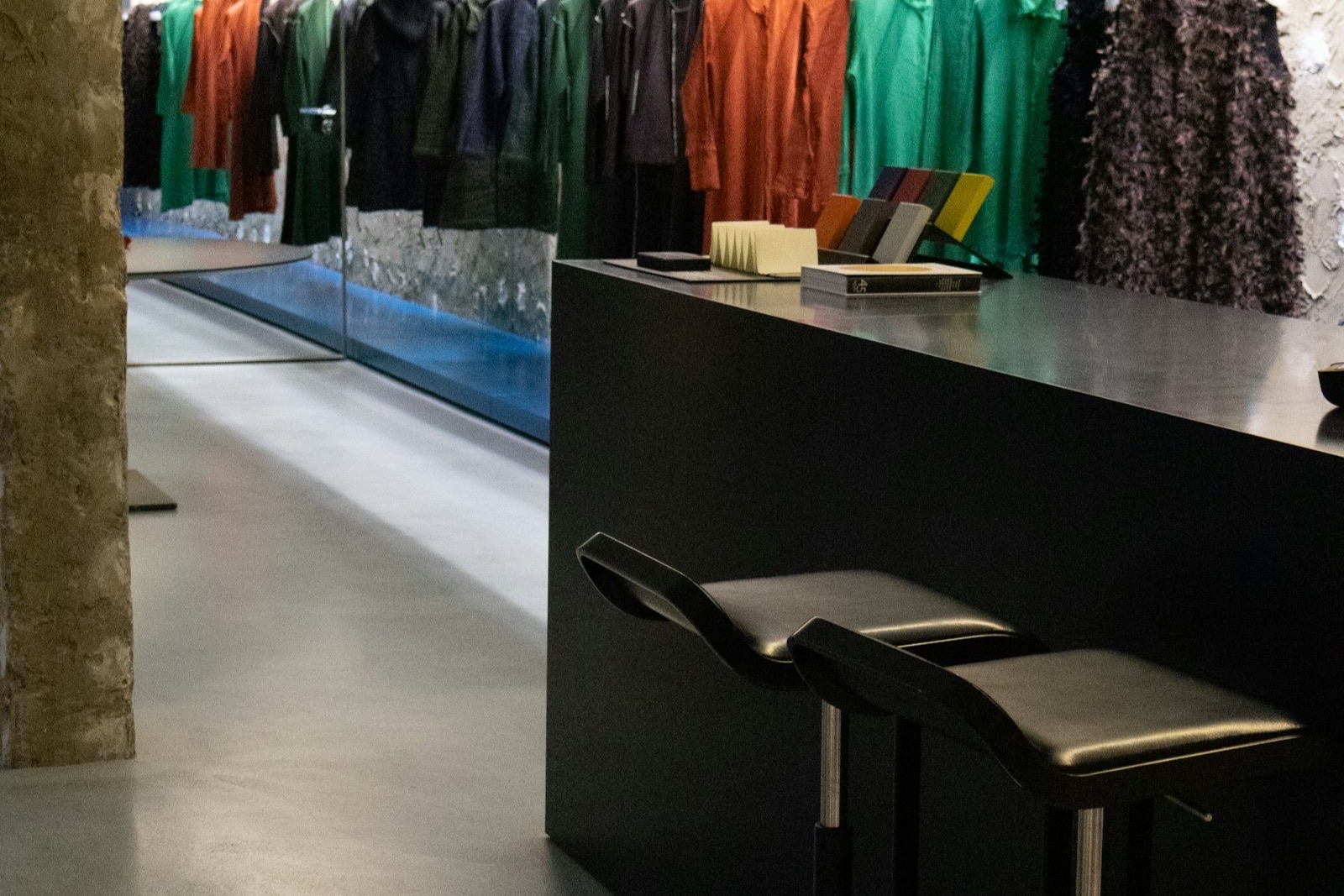 Customer completing a purchase at a boutique retail register