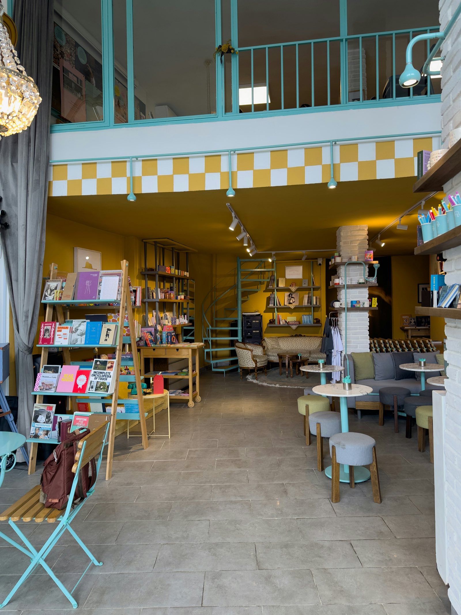 Bright independent bookstore interior with seating area